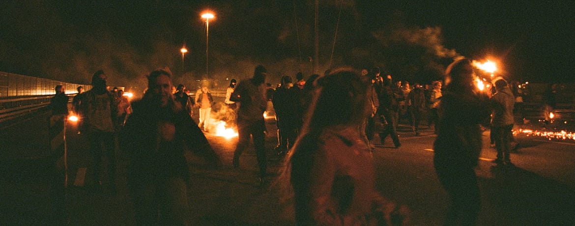 people at a protest at night